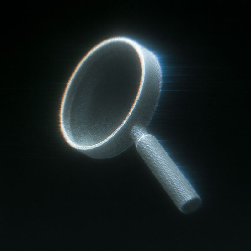 Glowing magnifying glass on a black background
